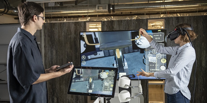 Man and woman use virtual reality software at a technology center in Toronto, Canada